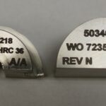 A pair of metal plates with numbers on them.