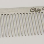 A comb with the chin down written on it.