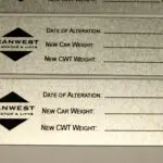 A close up of the front and back covers of two new car weights.
