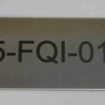 A metal sign with the number 5-fqi-0 1 on it.