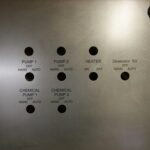 A close up of the buttons on a wall