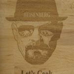 A wooden board with heisenberg etched into it.