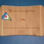 A wooden plaque with a maple leaf on it.