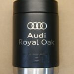A black cup with the words " audi royal oak ".