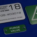 A close up of some tags and a valve tag