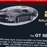 A sign with the ford mustang and shelby gt 5 0 0 on it.