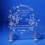 A clear glass plaque with the words " to my dearest heart ".