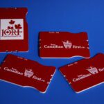 A group of four red and white business cards.