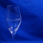 A glass of wine on a blue background