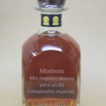 A bottle of whiskey with the name of modesto written in spanish.
