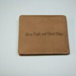 A brown wallet with the words " living right and least steps ".