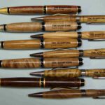 A group of wooden pens with the name dr. Hampton on them