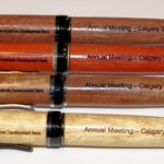 Four pens with the names of several different cities.