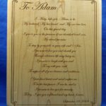 A wood plaque with the poem to adam written in it.