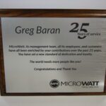 A plaque with the name of microwatt 's 2 5 th anniversary.