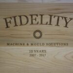 A wooden box with the word fidelity written on it.