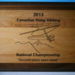 A plaque with the name of a canadian hang gliding national championship.