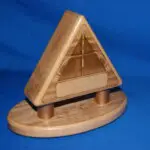 A wooden triangle puzzle on top of a blue surface.