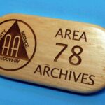 A wooden plaque with the words area 7 8 archives on it.