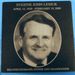 A plaque with an image of eugene john lesiuk.