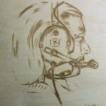 Picture of a man face printed on wood
