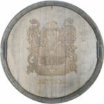 A wooden barrel with a coat of arms on it.